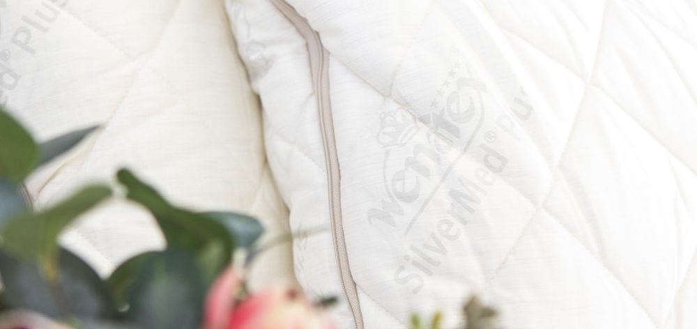 SilverMed pillow on a bed | Featured Image for How Often Should I Change My Pillow blog on Wenatex.