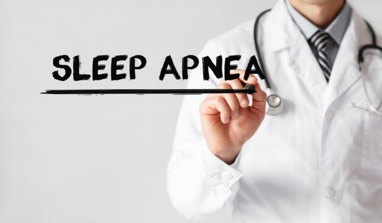 Doctor writing word sleep apnea with a marker | Featured image for Snoring or sleep Apnea?
