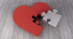 Red heart puzzle with one white puzzle piece | Featured image for Did you know sleep can affect the health of your heart? blog from Wenatex.