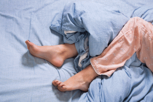 Photo of a persons legs and feet | Featured image for Are your legs feeling restless?