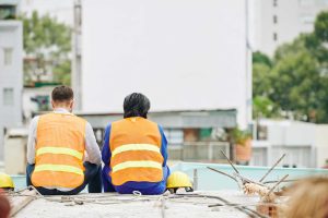 Construction workers resting after a shift | Featured image for Wenatex’s Sleep Tips for Shift Workers Blog.