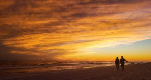 Friends exercising at sunset | Featured image for Wenatex’s The Role of Regular Exercise in Promoting Quality Sleep Blog.
