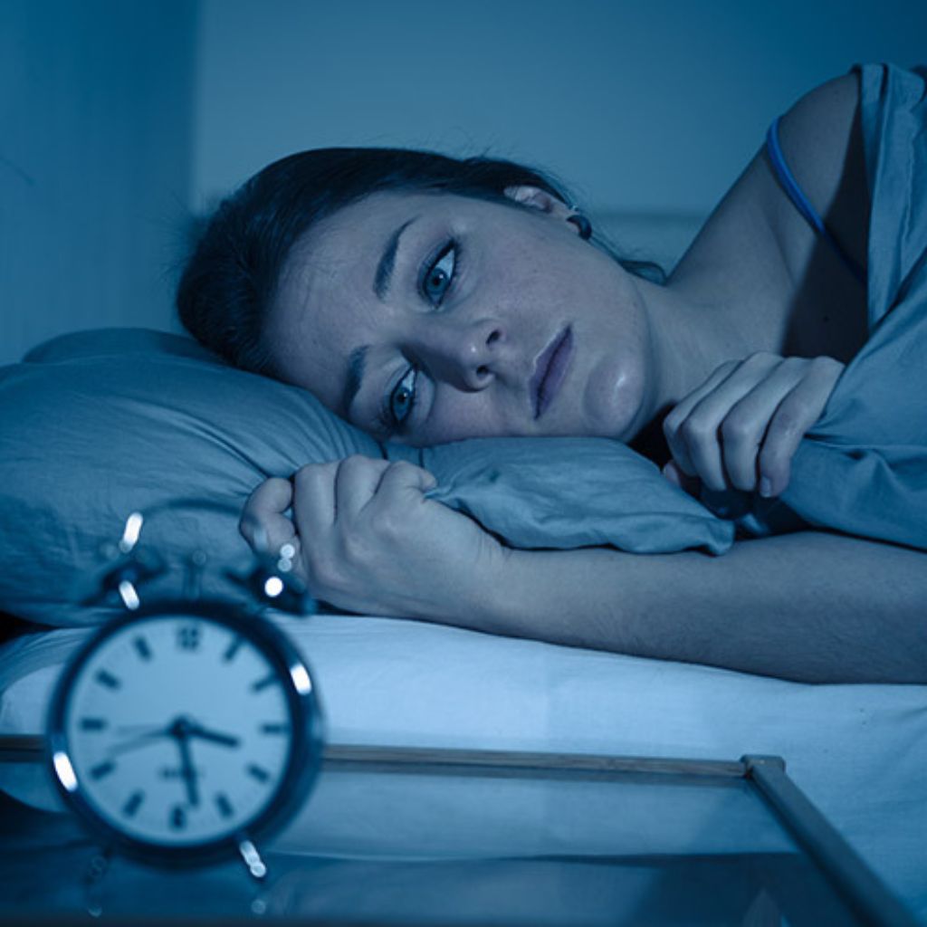 Woman having trouble sleeping| Featured Image for the Cause of Sleepless Nights Blog by Wenatex.
