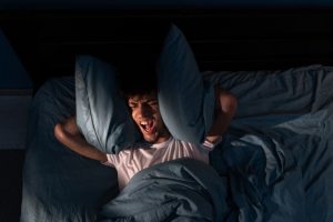 Sleepless Man | Featured image for the Sleep Apnea blog from Wenatex.
