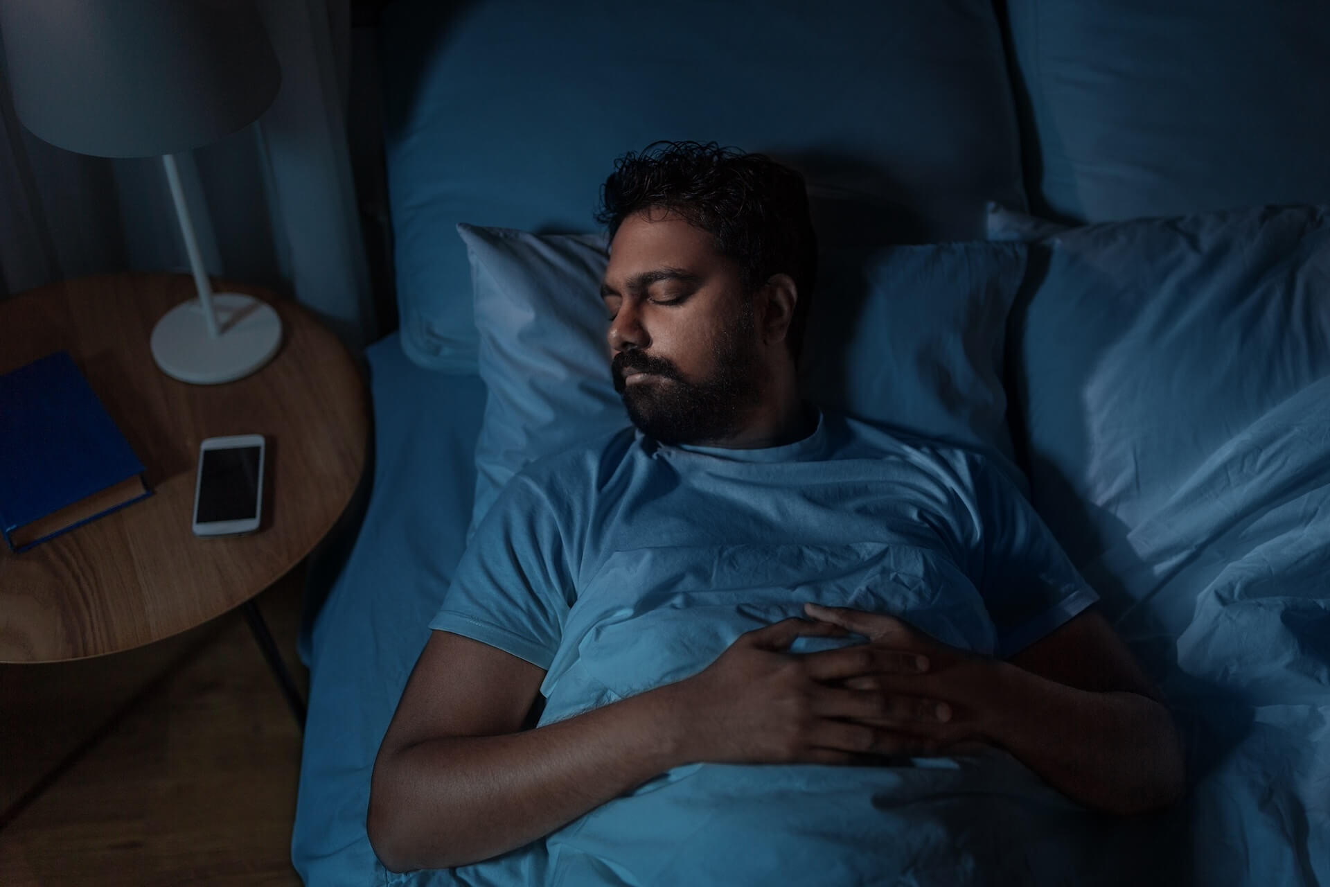 Man in a deep stage of sleep | Featured image for Deep Stage of Sleep Blog on SleepHub.